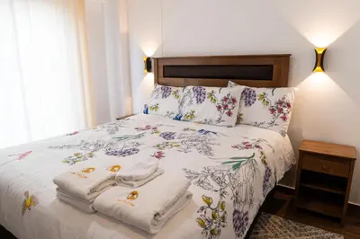 a bedroom with a bed with towels on it at Lama Vista Living 202 in Cusco