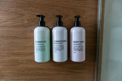 a group of three shampoo bottles sitting on a table at Lama Vista Living 202 in Cusco