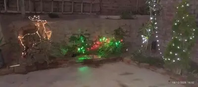 an image of a garden with christmas lights at Departamento con Cochera gratuita dentro de Instalaciones 8p Tierra del Sol Eterno Ica centro in Ica