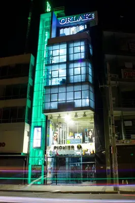 a tall building with a sign on top of it at Hotel Orlak in Huancayo