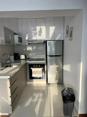 a kitchen with white cabinets and an oven at Wonderful apartment Miraflores Kennedy 603A in Lima