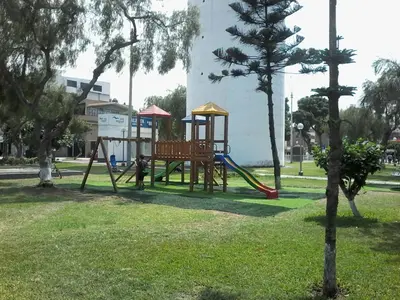 a park with a playground in the grass at Royal Sweet Dreams Airport B&B in Lima