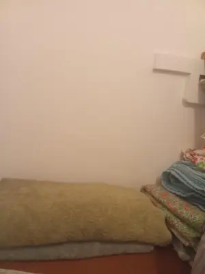 a couch in a room with a white wall at Cristal in Lima