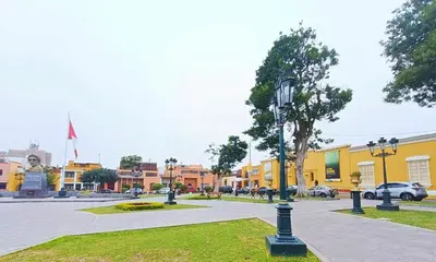 a street light in the middle of a city at Casa Turística Monumental in Lima
