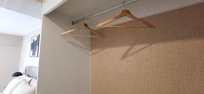 a bedroom with wooden hangers on the wall at Hermoso Departamento Miraflores in Lima