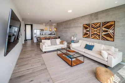 a living room with two white couches and a table at Aldea 2BR Ocean View Luxury for 4ppl or 2 couples in Paracas
