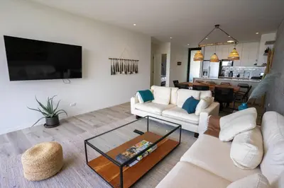 a living room with a couch and a table at Aldea 2BR Ocean View Luxury for 4ppl or 2 couples in Paracas