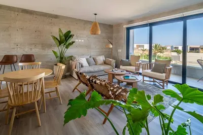 a living room with a couch and a table at Aldea 2BR Boho Style for 4 with Gym, Pool and Cowork in Paracas