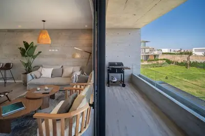 a living room with a couch and a table at Aldea 2BR Boho Style for 4 with Gym, Pool and Cowork in Paracas
