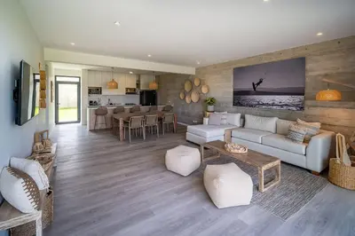 a living room with a couch and a table at Aldea 2BR Family, Big FrontYard for 6 with Gym and Pool in Paracas