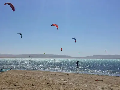 a group of people flying kites on the beach at Aldea 2BR, Service Room and Ocean View for 7 in Paracas