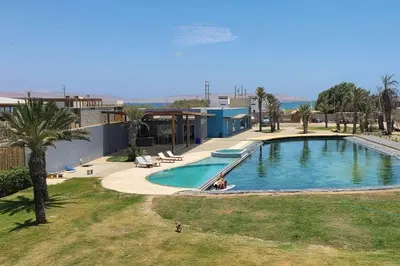 an overhead view of a swimming pool in a resort at Aldea 3 Bedroom Terrace Escape with Service Room in Paracas