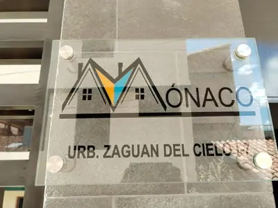 a sign on the side of a building at Casa Mónaco in Cusco