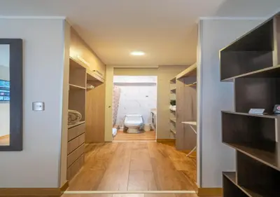 a bathroom with a toilet in a room at Luxury Flat Miraflores Pool Gym Fast WiFi Balcony in Lima