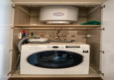 a washer and dryer in a utility room at Luxury Flat Miraflores Pool Gym Fast WiFi Balcony in Lima