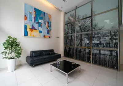 a living room with a couch and a table at Luxury Flat Miraflores Pool Gym Fast WiFi Balcony in Lima