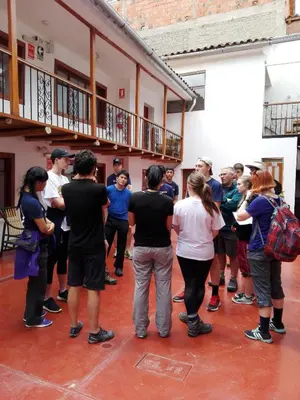 a group of people standing around in a room at Casa San Pedro Cusco in Cusco