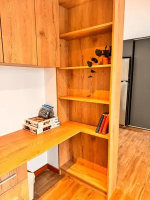 a book shelf in a room with wooden shelves at betoben in Lima