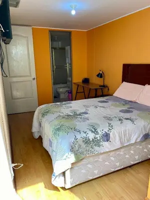 a bedroom with a bed and a bathroom at Omi's Room 2 in Lima