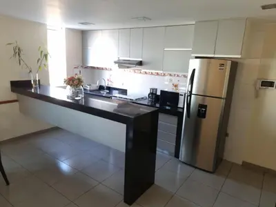 a kitchen with a stainless steel refrigerator and cabinets at Hermoso Departamento en Pueblo Libre in Lima