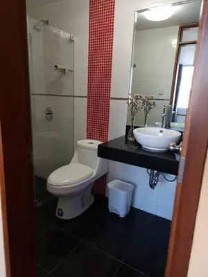 a bathroom with a toilet and a sink at Hermoso Departamento en Pueblo Libre in Lima