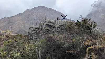 a person standing on top of a mountain at EcoLodge Mayu Camping in Tanca