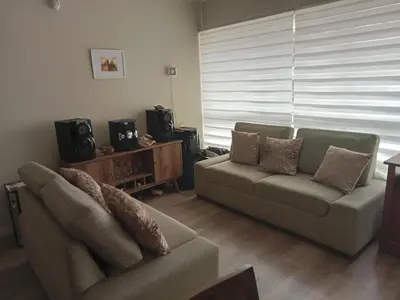 a living room with a couch and a chair at Lindo mini apart Pueblo libre Lima in Lima