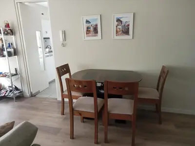 a dining room table and chairs in a room at Lindo mini apart Pueblo libre Lima in Lima