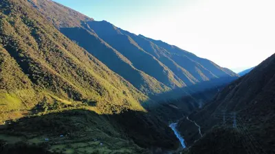 a view of a mountain valley with a river at Salkantay Lodge Collpapampa in Colcapampa