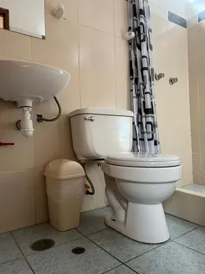 a bathroom with a toilet and a sink at Hospedaje El Centro in Ayacucho