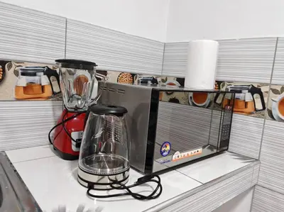 a kitchen counter with a blender on top of it at Apartamento de Kelita in Ayacucho