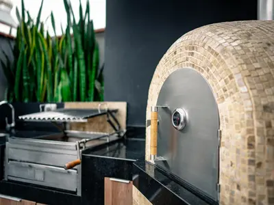 a kitchen with a counter with a brick wall at Beautiful and Well Located in Lima