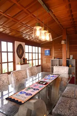 a dining room with a glass table and chairs at Gran Olivar Suite de San Isidro -3 Habitaciones in Lima