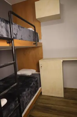 a room with two bunk beds and a ladder at Casa sabina aeropuerto entera in Lima