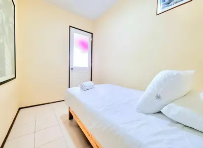 a small bedroom with a bed and a window at FlatTOP San Isidro City View Lima 3B 1804 in Lima