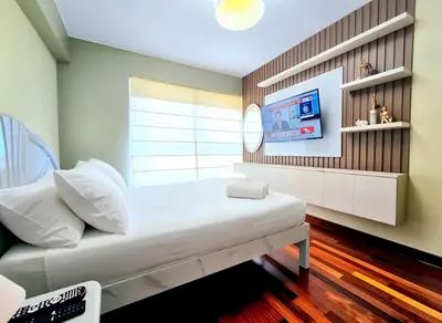 a hospital room with a bed and a tv at FlatTOP San Isidro City View Lima 3B 1804 in Lima