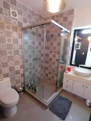 a bathroom with a shower and a toilet and a sink at Barranco-Miraflores, ubicación A1, hermosa vista in Lima