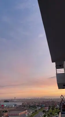 a view of a city at sunset with the horizon at Romi Apartment in Lima