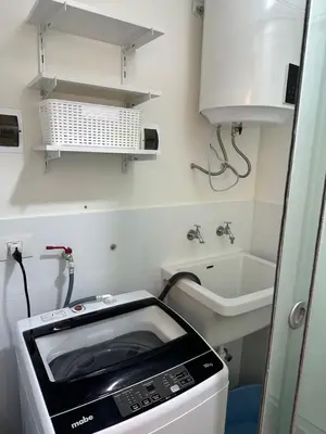 a kitchen with a toaster oven and a sink at San Isidro, lindo depa , 2tv wifi, piscina, lavanderia in Lima