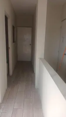 an empty room with white walls and a tile floor at Departamento Duplex Aeropuerto y plaza cerca de ti! in Lima