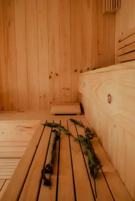 a sauna with skis sitting on a wooden floor at Narea San Bartolo in San Bartolo