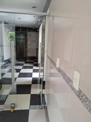 a lobby with a checkered floor and a elevator at HOSPEDAJE JOVITa in Lima