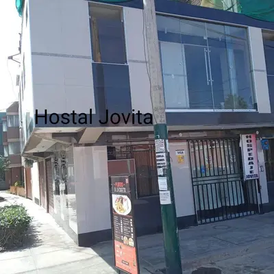 a building with a hospital joliota sign on a street at HOSPEDAJE JOVITa in Lima