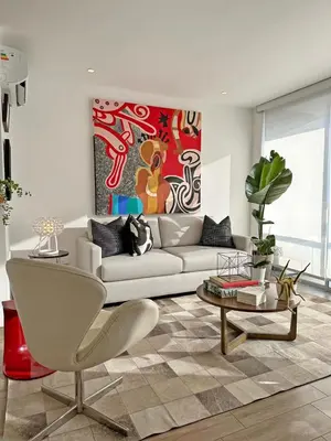 a living room with a couch and a table at Departamento de lujo Miraflores con Aire Acondicionado in Lima