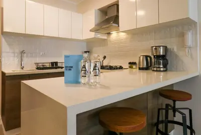 a kitchen with two glass bottles on a counter at Artline in Barranco by Wynwood House in Lima