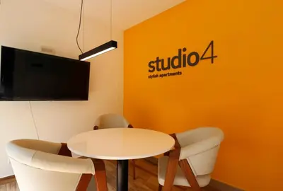 a meeting room with a white table and chairs at Studio 4 by Wynwood House in Lima