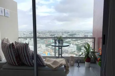 a living room with a view of a city at Premium Loft-Moderno y Acogedor in Lima