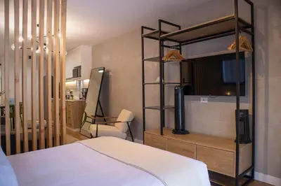 a bedroom with a bunk bed and a chair at Pendragon by Wynwood House in Lima