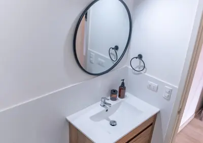 a bathroom with a sink and a mirror at Maravilla en barranco BR1 in Lima