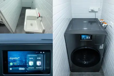 a washing machine in a bathroom next to a sink at Modern loft in front of the boardwalk and the sea in Lima